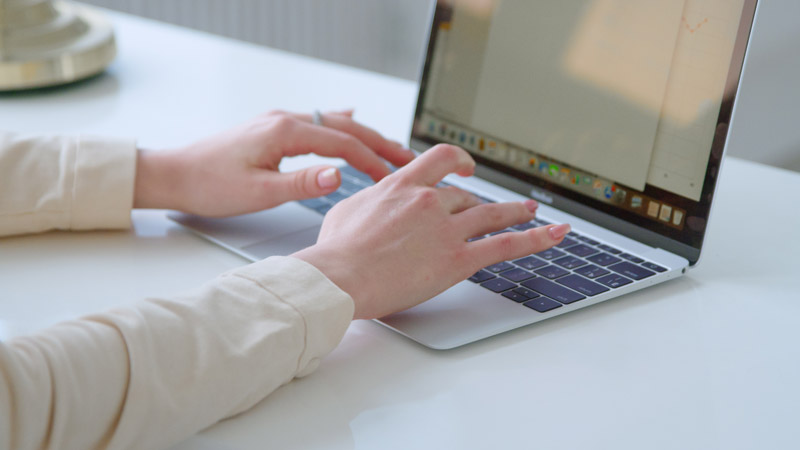 Woman looking for windshield replacement on computer